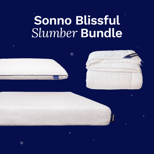 Sonno Blissful Slumber Bundle featuring a firm grey mattress, a soft comforter, and a textured pillow, all arranged against a dark blue starry background. This image highlights luxurious sleep products designed for ultimate comfort, with the text 'Sonno Blissful Slumber Bundle' clearly visible.