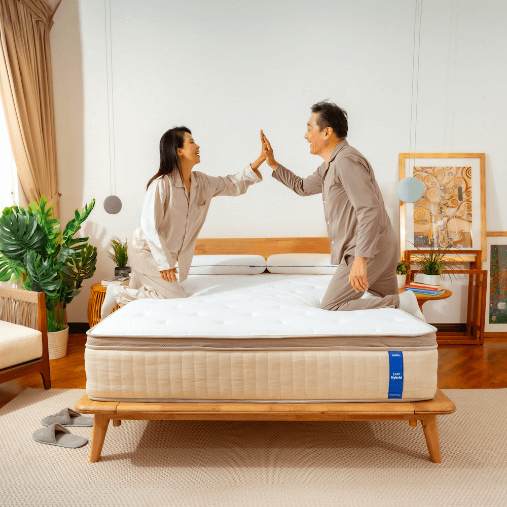 Couple enjoying the comfort and support of the Sonno Luxe Hybrid mattress with natural latex and memory foam in Malaysia.