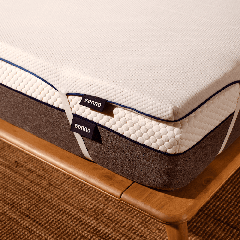 Close-up of Sonno mattress topper with memory foam and charcoal layer, designed to enhance mattress comfort.