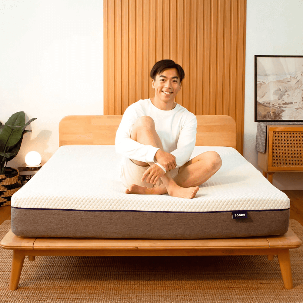 Man Sitting on Sonno Original Mattress - Best Pressure Relief Mattress Malaysia